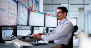 Overemployed Worker with 5 Screens